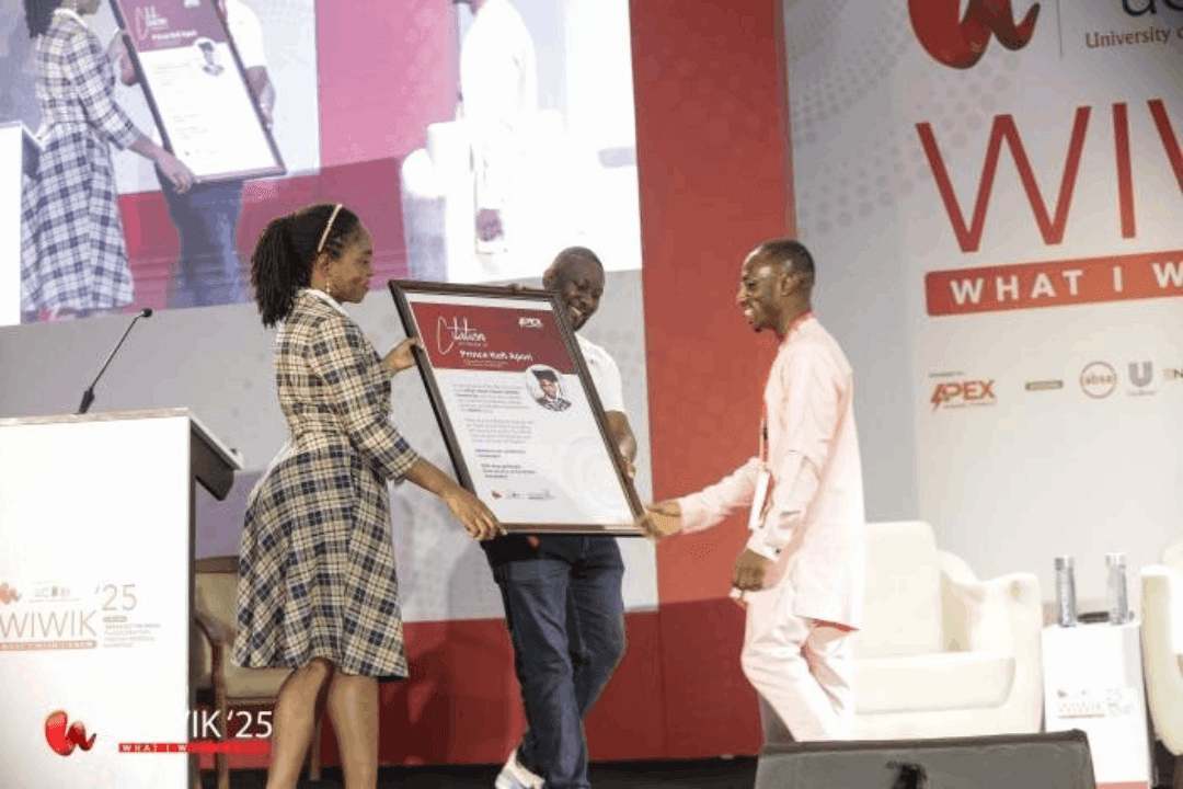 Walking to the WIWIK 2025 stage to receive award